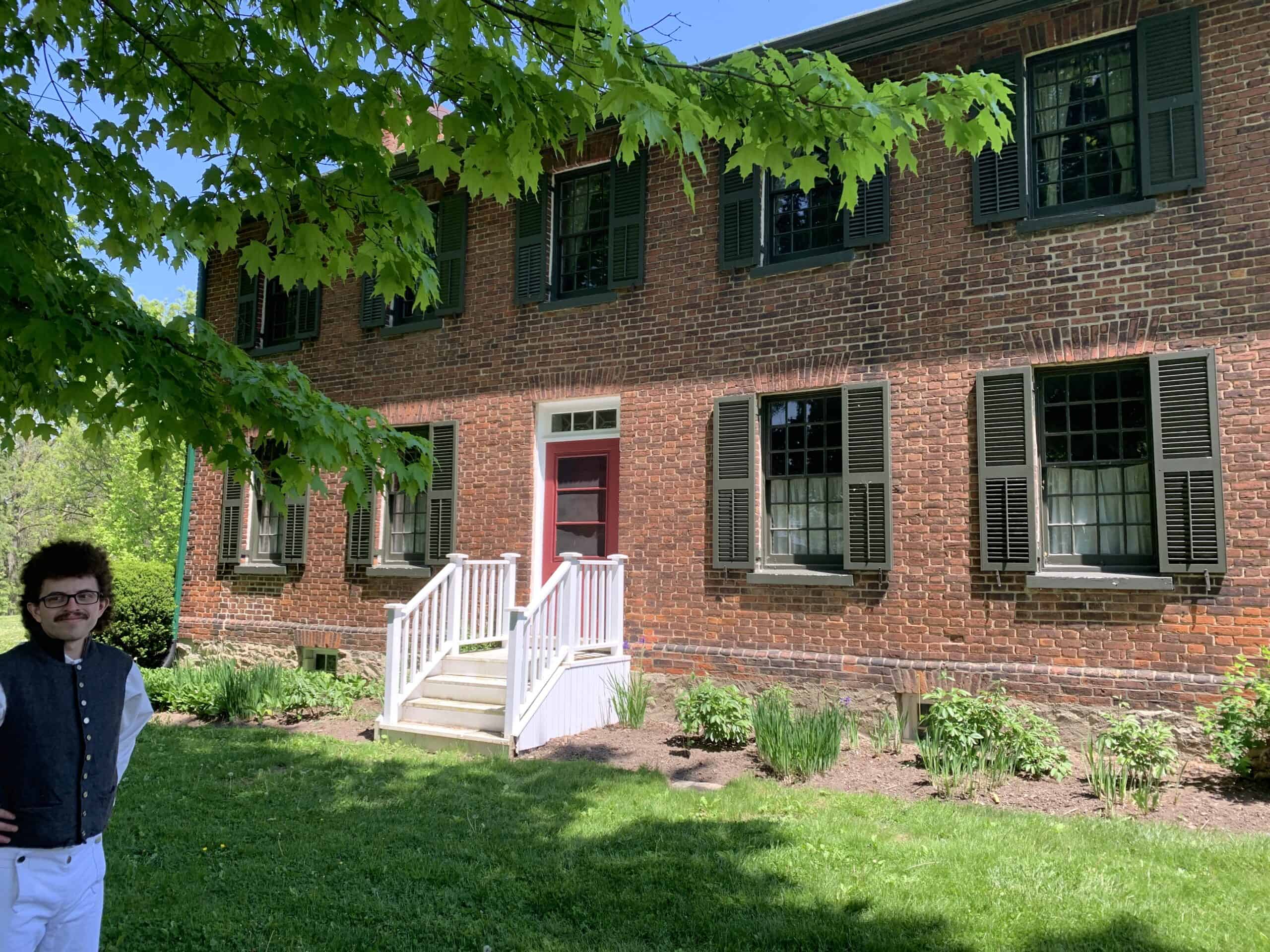 The historic front to the McFarland House with a staff in period costume.