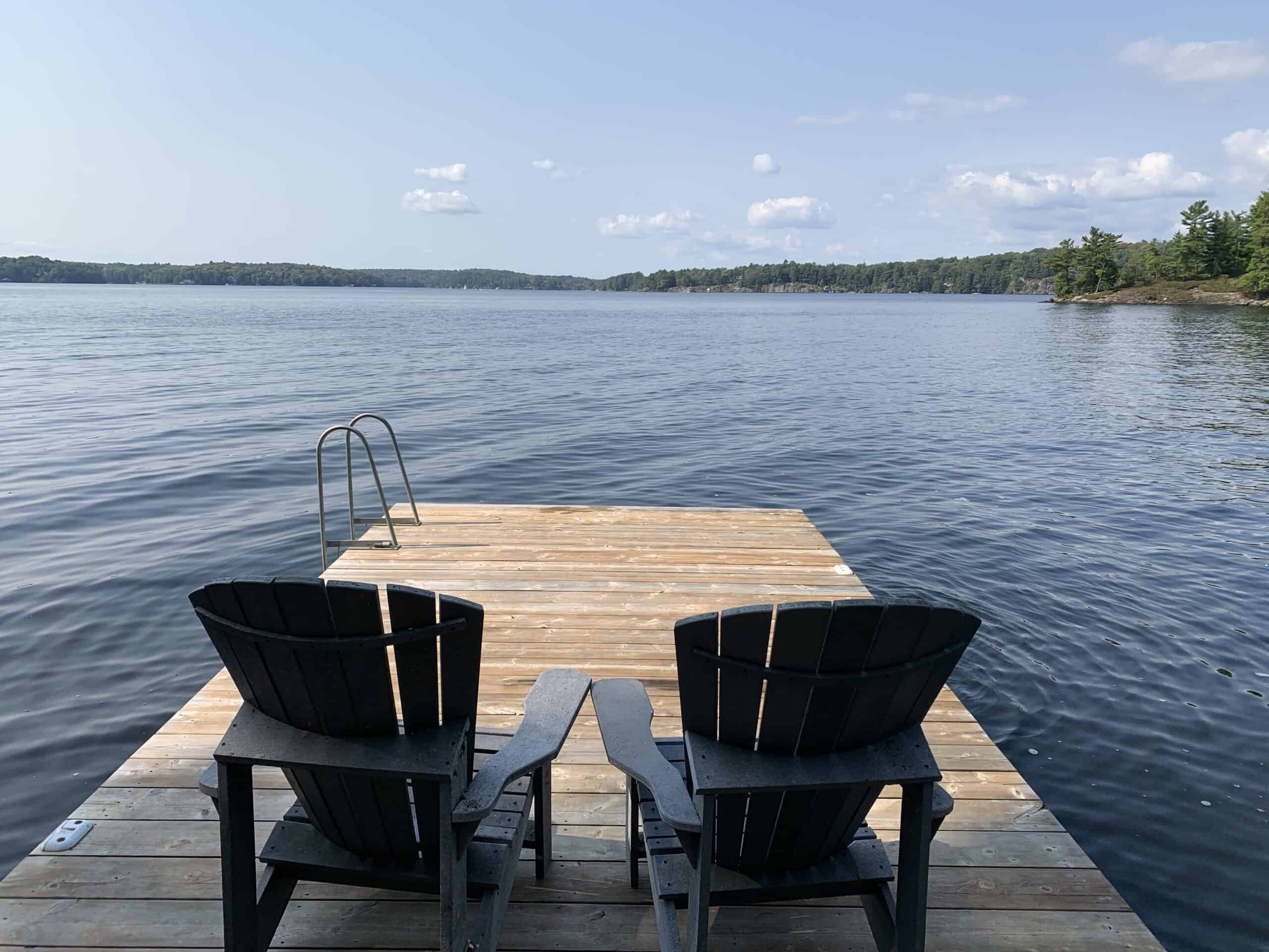 muskoka chairs on a dock