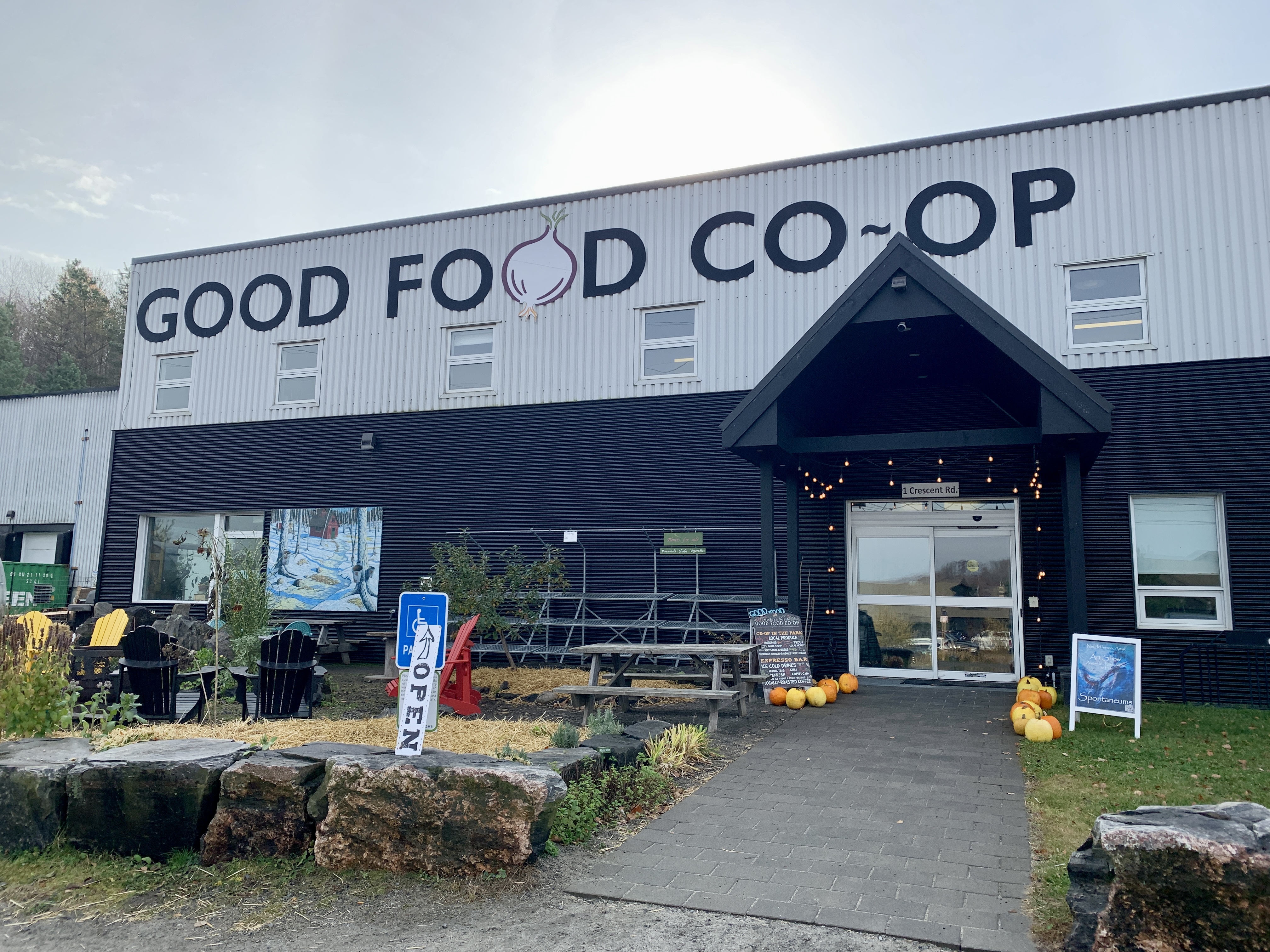 The outside of the Good Food Co-op looks rather industrial but the inside feels like a farmer's market mixed with a café.