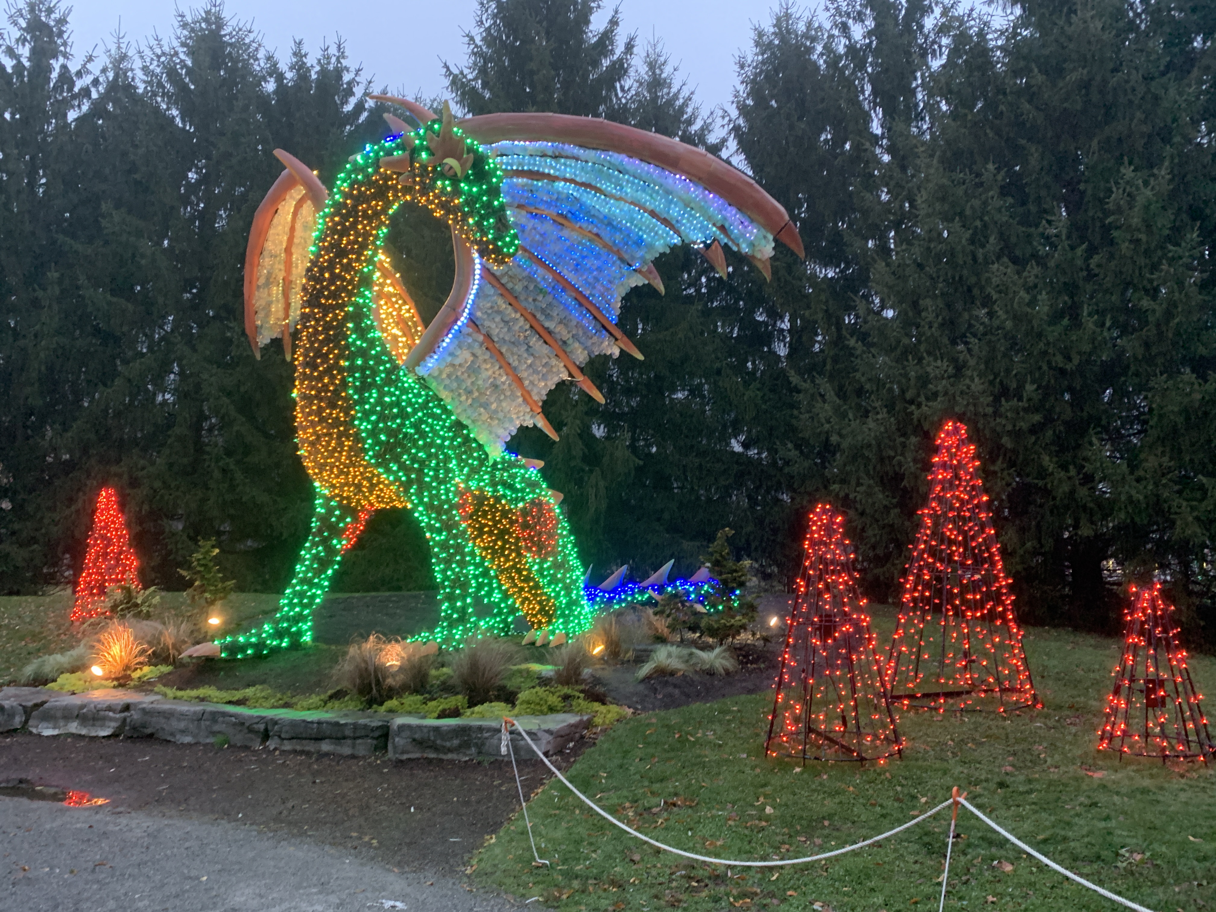 A massive display dragon enhanced by Christmas lights.