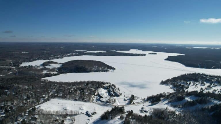 Arial view of a frozen lake in Muskoka